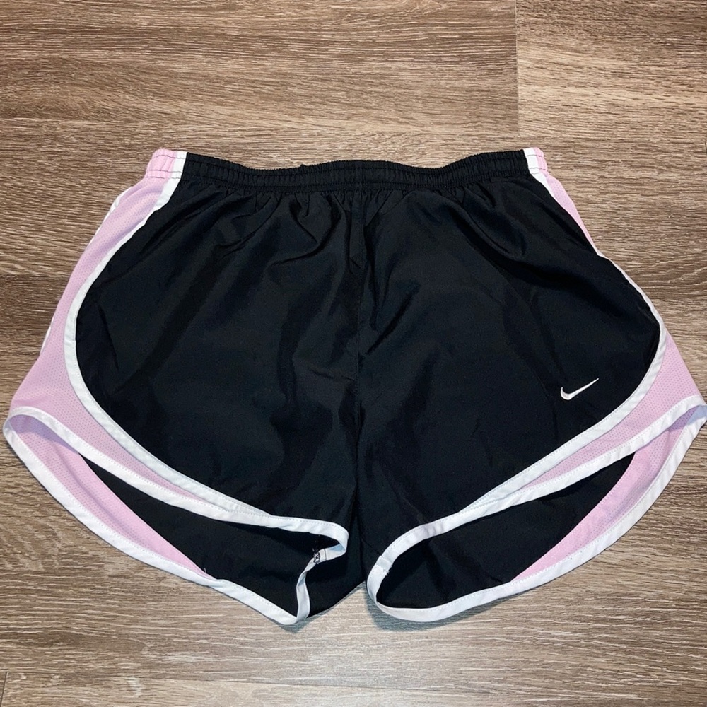 Black, pink, and white athletic shorts